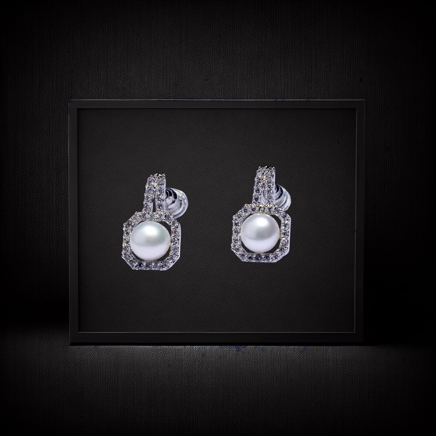 Diamond pearl earrings with silver accents