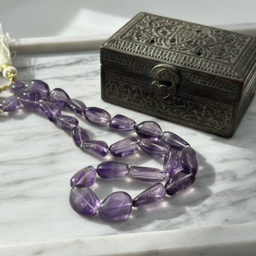 Detail view of the handcrafted Amara Natural Amethyst Necklace and its finishing.