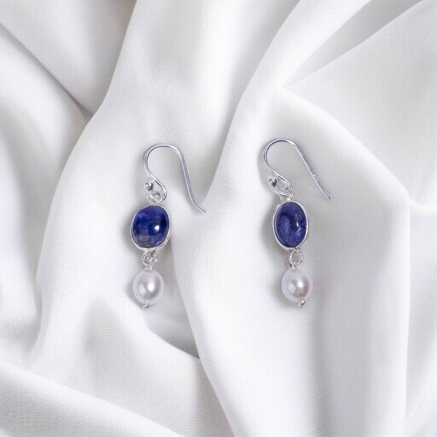 Silver earrings with blue tanzanite gemstones and pearls