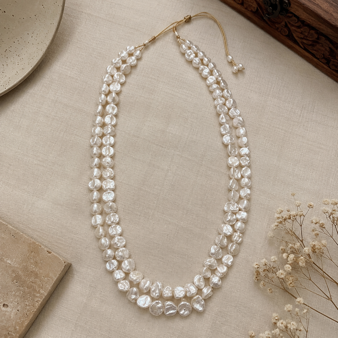 Elara Keshi Pearl Necklace handcrafted with genuine freshwater keshi pearls in a chunky double-strand design with an adjustable dori.