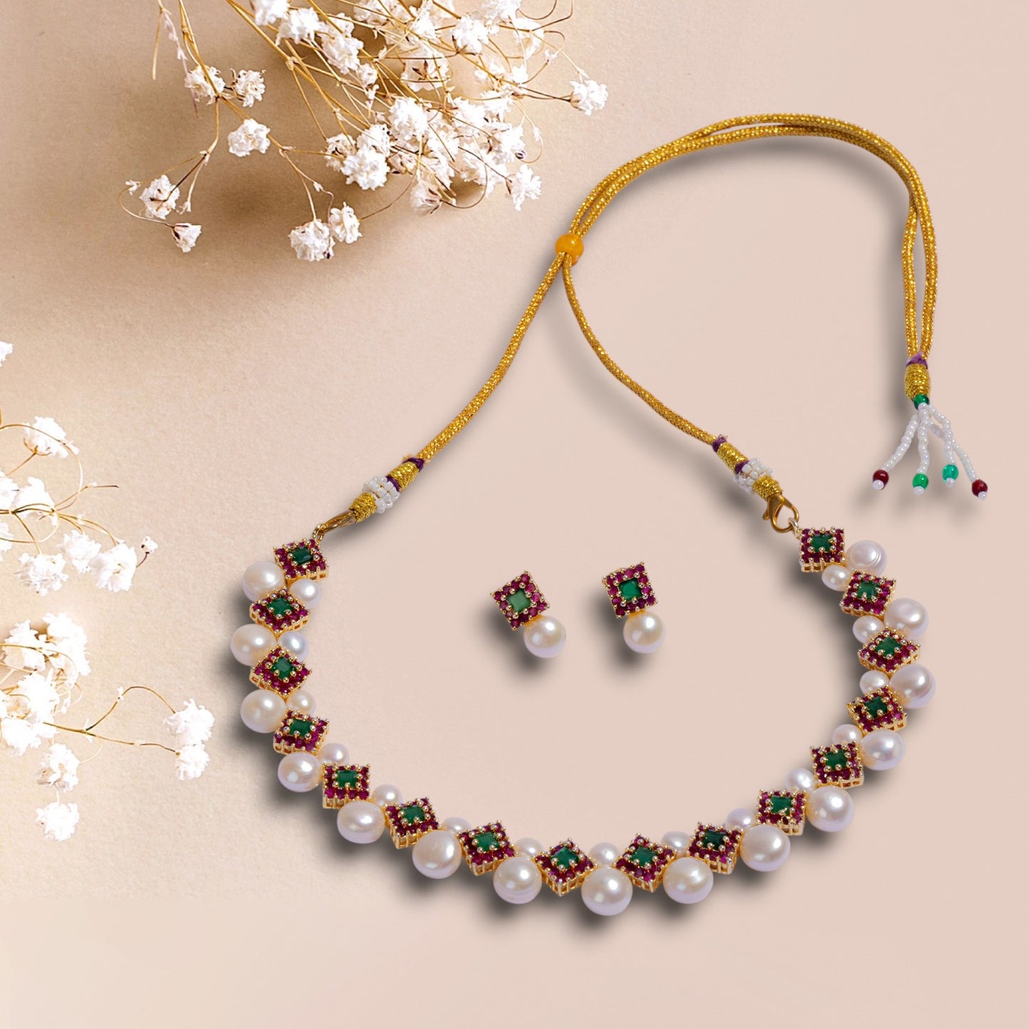 Pearl necklace with gemstone accents and matching earrings