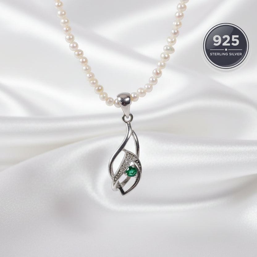 Pearl necklace with a silver pendant and a green emerald gemstone 
