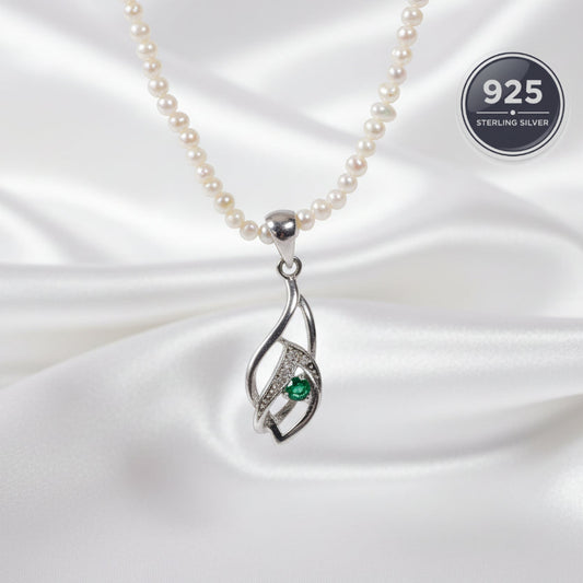 Pearl necklace with a silver pendant and a green emerald gemstone 