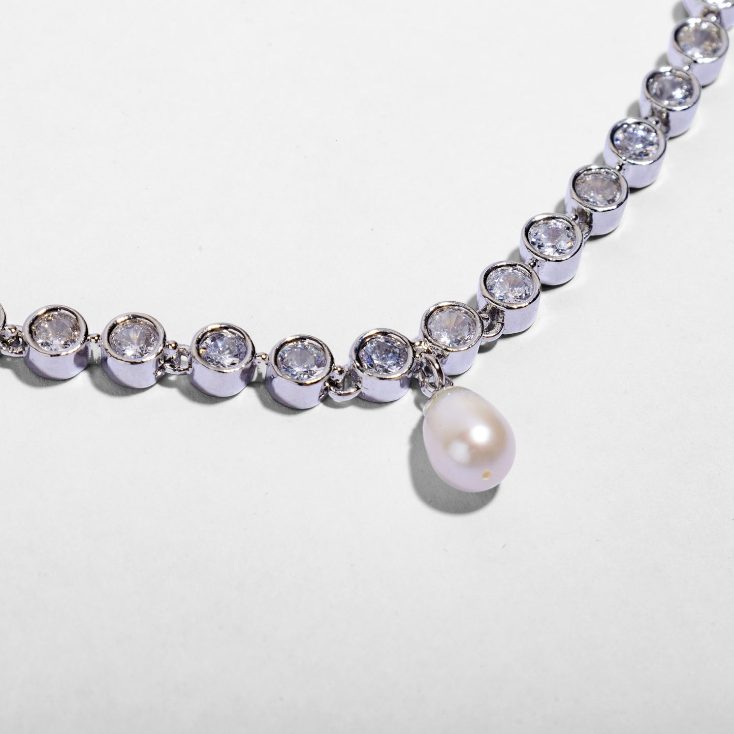 Diamond Pearl necklace with silver and clear gemstones