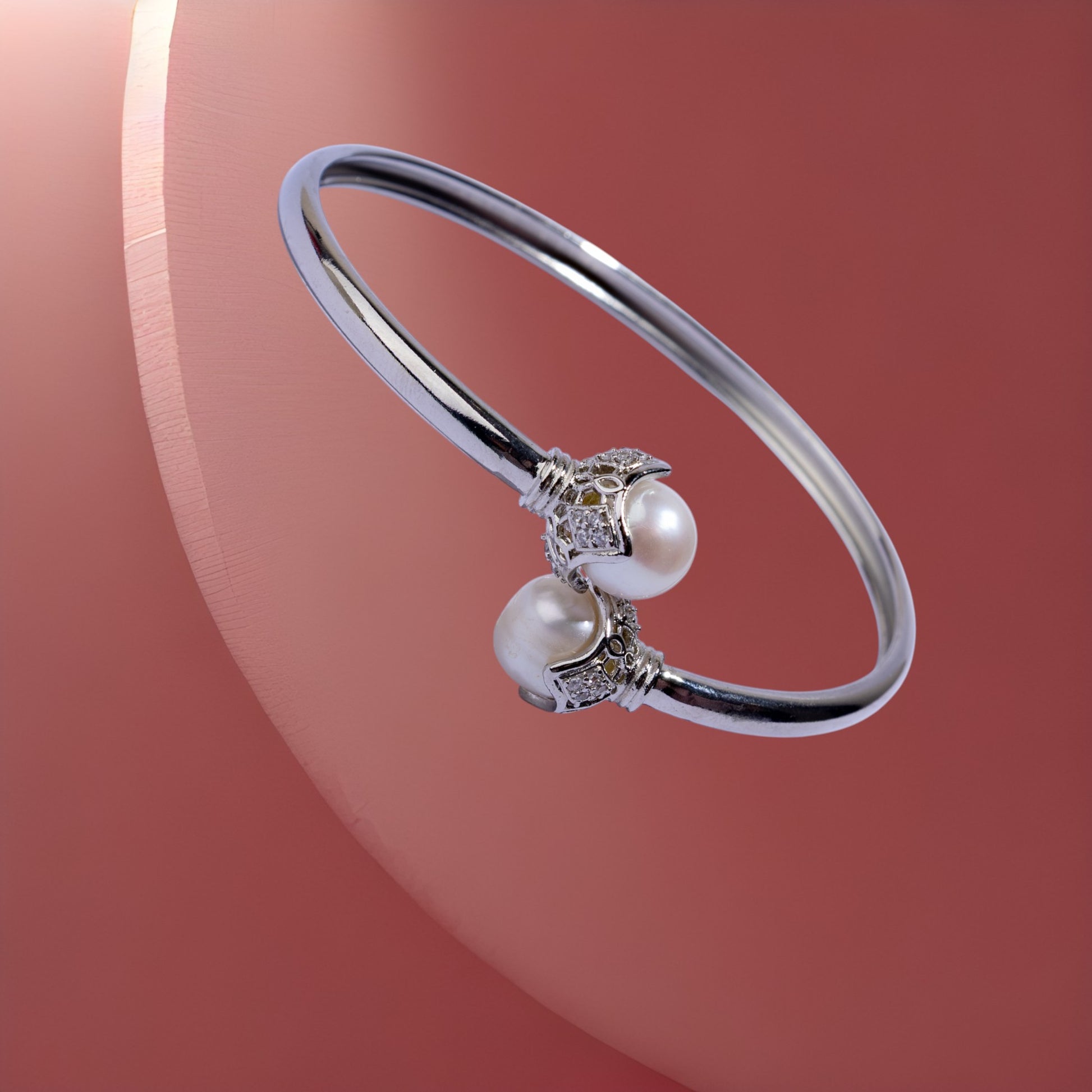 Silver cuff bracelet with pearl charms 