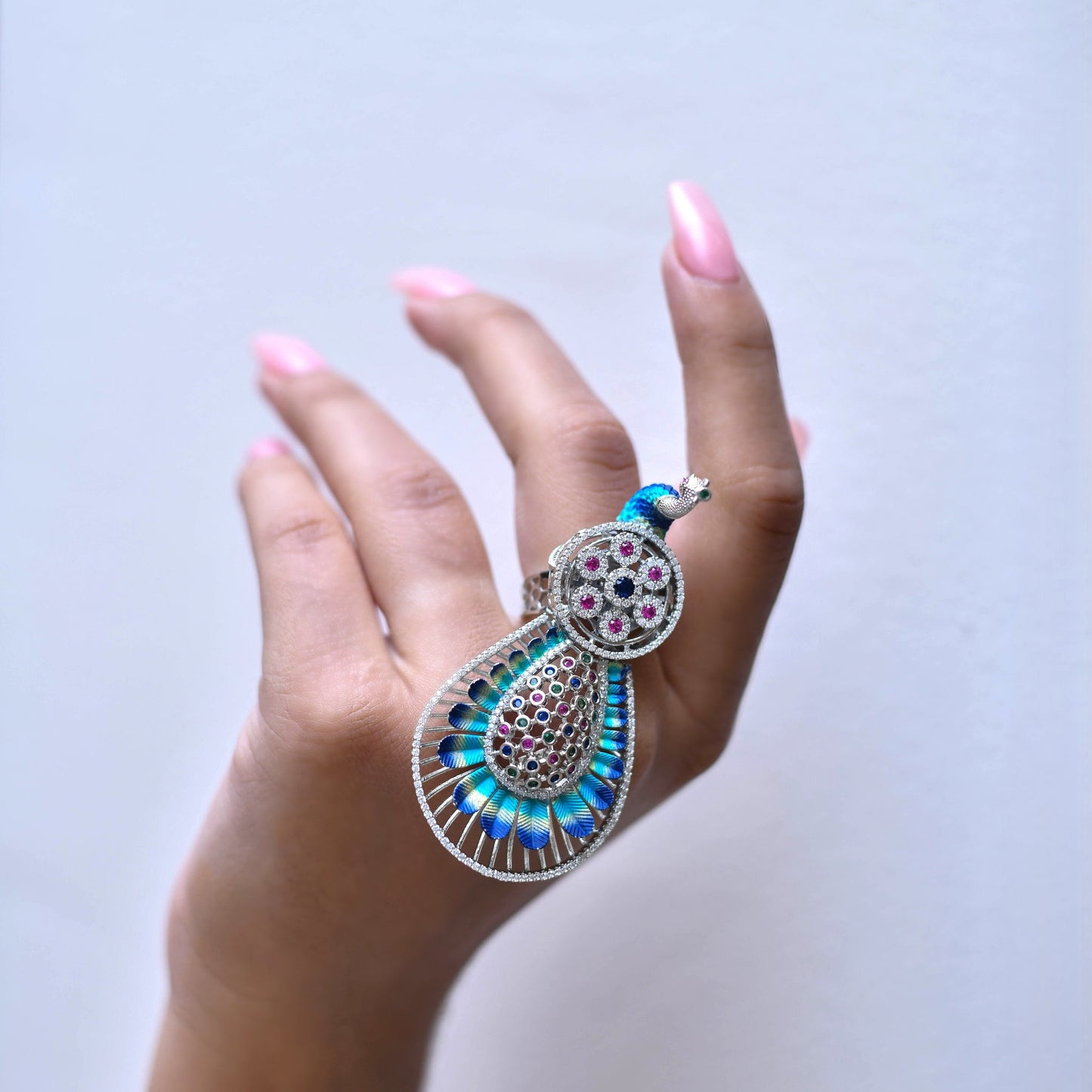 Silver decorative ring with a peacock design 