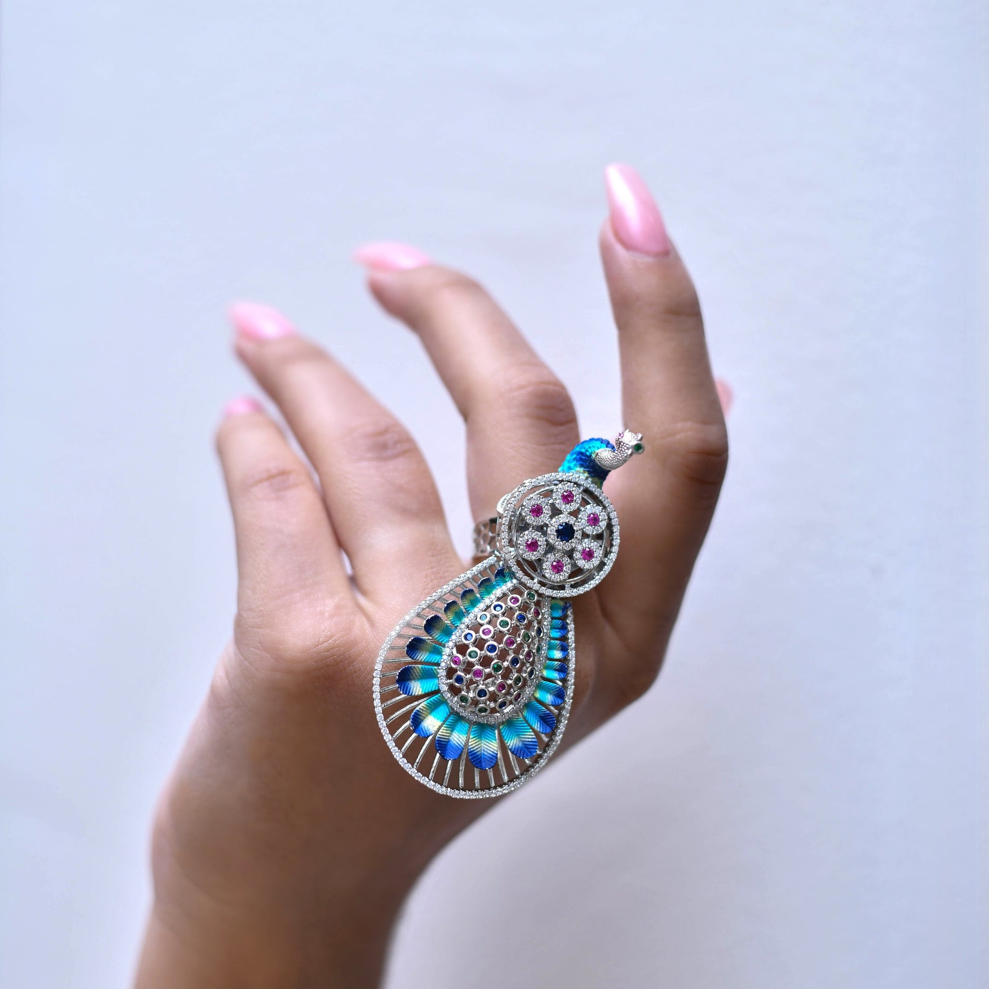 Silver decorative ring with a peacock design 