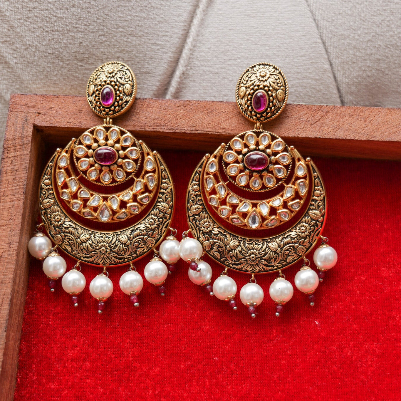 Ornate gold Kundan chandbali earrings with pearls 