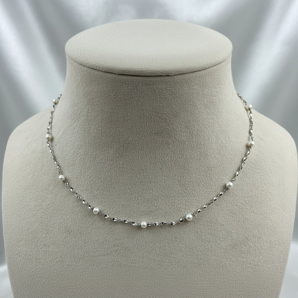 Aurea 925 Sterling Silver Pearl Chain featuring genuine freshwater pearls evenly spaced along a twisted sterling silver chain.