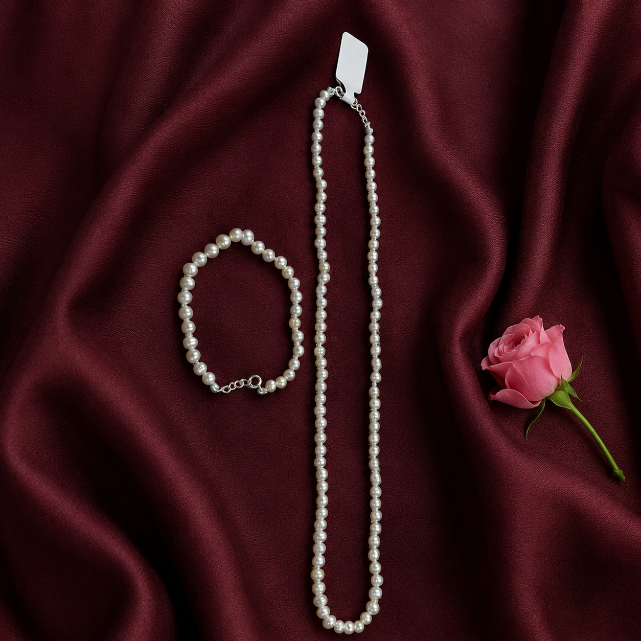 Bella Pearl Set featuring a genuine freshwater pearl necklace and matching bracelet displayed together.