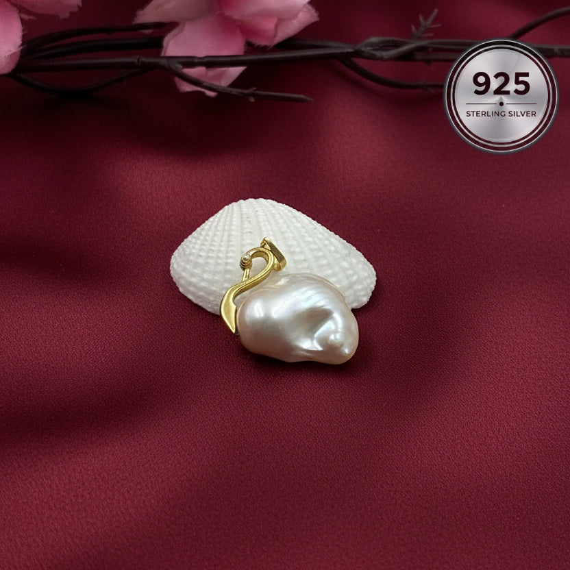 Celeste Swan Baroque Pearl Pendant handcrafted with a genuine freshwater baroque pearl and sterling silver swan bail.