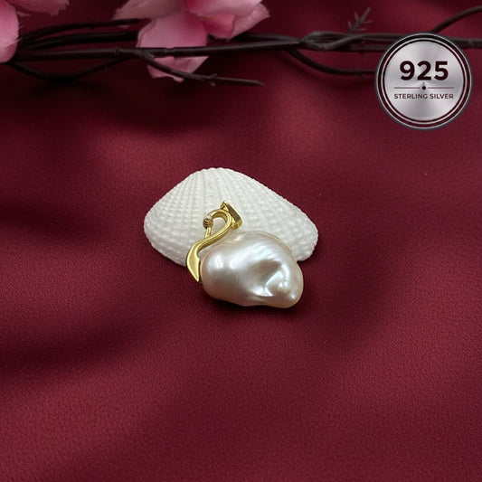 Celeste Swan Baroque Pearl Pendant handcrafted with a genuine freshwater baroque pearl and sterling silver swan bail.