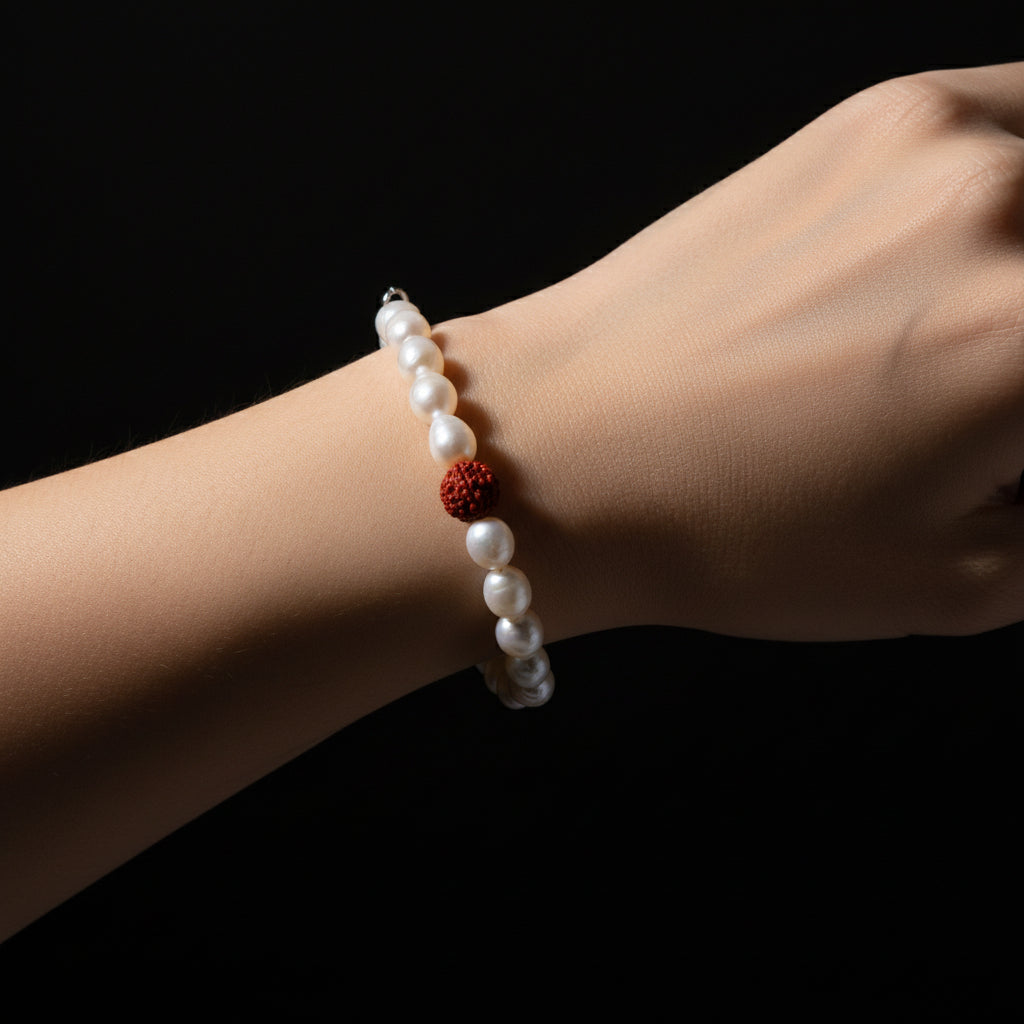 Woman wearing the Divine Pearl Bracelet with freshwater pearls and Indonesian Rudraksha